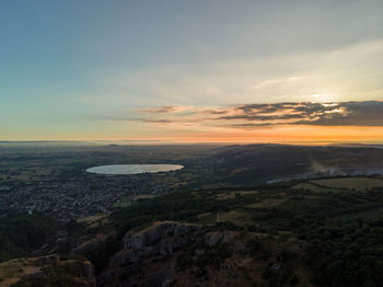 Aerial view of landscape against sky during sunset