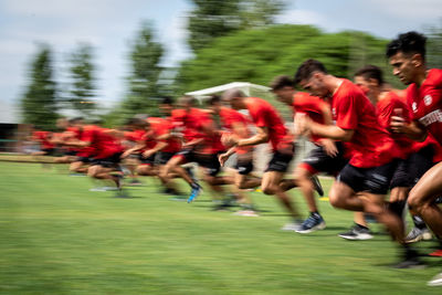 Group of people running outdoors