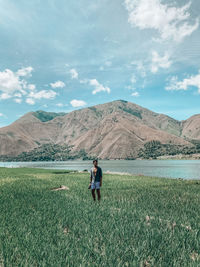 Palipi samosir, indonesia - a man stand in the rice field with lake and hills