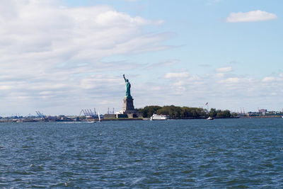 Statue of liberty with city in background