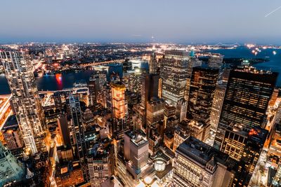 High angle view of illuminated city buildings at night