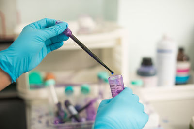 Cropped hands of scientist experimenting in laboratory