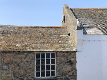 Low angle view of old building against clear sky