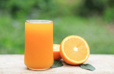 Close-up of orange juice on table