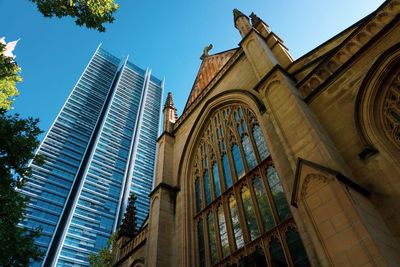 Low angle view of buildings against blue sky