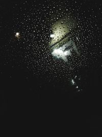 Close-up of raindrops on glass window