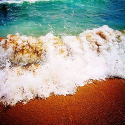 Scenic view of sea waves splashing on shore