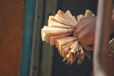 Close-up of hand holding paper currency