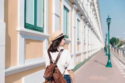 Woman standing in front of building