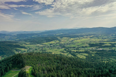 Scenic view of agricultural landscape against sky