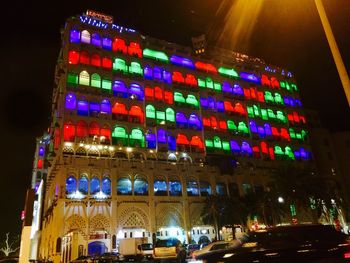 Low angle view of illuminated building at night