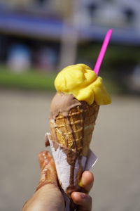 Hand holding ice cream cone