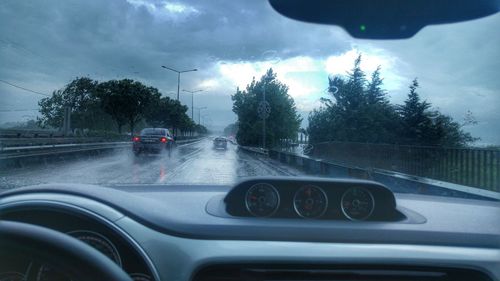 Road seen through car windshield