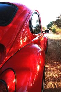 Close-up of red car on road