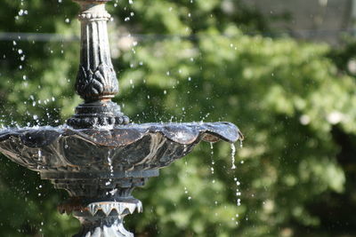 Close-up of water fountain against blurred background