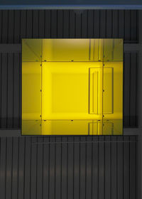 Yellow window on building