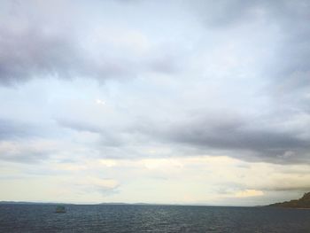 Scenic view of sea and cloudy sky