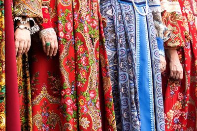 Midsection of women wearing traditional clothing