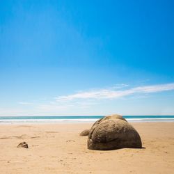 Scenic view of sea against blue sky