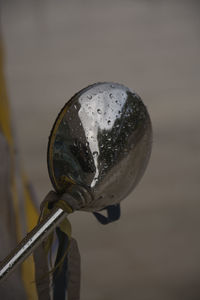 Close-up of sunglasses against sky