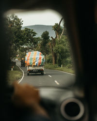 Car on road from the backseat view