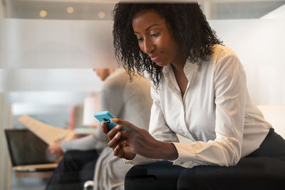 Woman using mobile phone