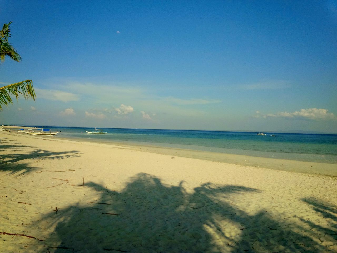 beach, sea, horizon over water, sand, shore, water, tranquil scene, tranquility, scenics, sky, beauty in nature, nature, blue, coastline, idyllic, calm, wave, outdoors, remote, no people