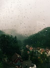 Close-up of wet window in rainy season