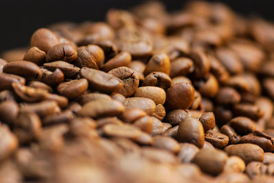 Close-up of coffee beans on table