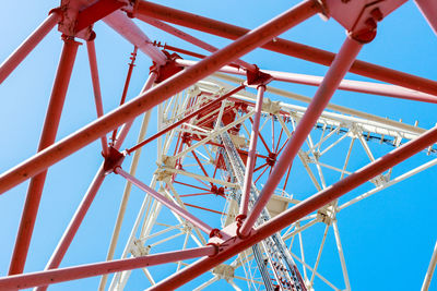 The communication tower stands against the sky with a bottom-up view. close-up