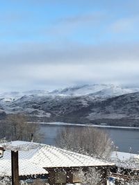 Scenic view of frozen lake against sky