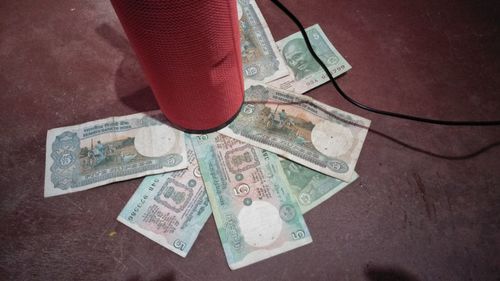 High angle view of coins on table