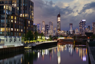 Reflection of illuminated buildings in canal at night