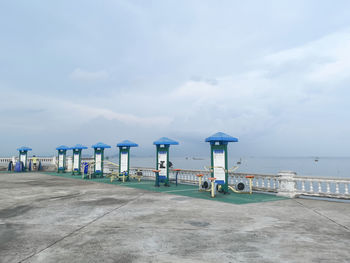 Lifeguard hut on beach against sky