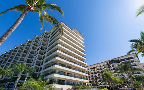 Low angle view of building against blue sky