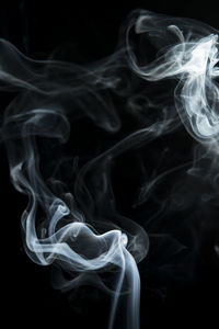 Close-up of smoke against black background