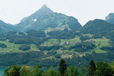 Scenic view of landscape and mountains against sky