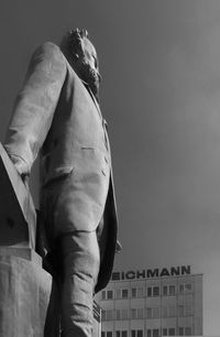 Low angle view of statue against building