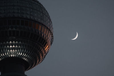 Low angle view of moon against sky at dusk