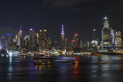 Illuminated buildings in city at night