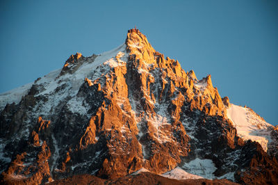 Scenic view of snowcapped mountains against clear sky