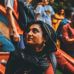 Close-up of smiling woman looking away