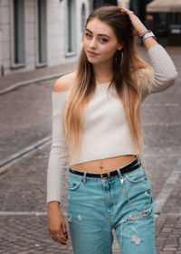 Young woman wearing hat standing outdoors