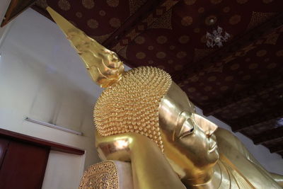 Low angle view of buddha statue in temple