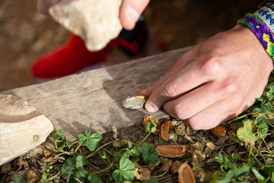 Midsection of man working on wood