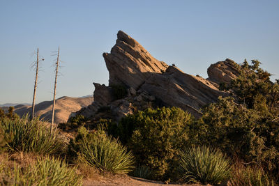 Scenic view of rocky mountains against clear sky