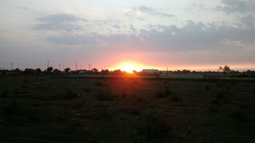 Scenic view of landscape at sunset