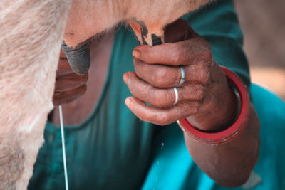 Close-up of man holding hands