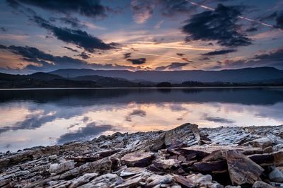 Scenic view of lake against sky during sunset