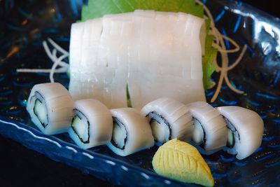 Close-up of squid sushi served in plate